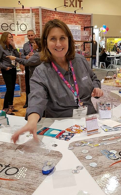 sue-working-the-deflecto-booth