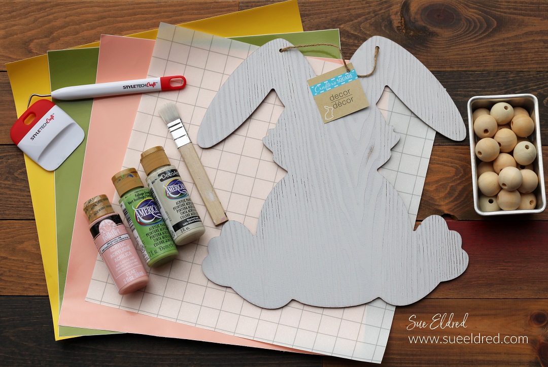 How to make a Spring Bunny Door Hanger with a Dollar Tree Bunny, Acrylic Paint, and StyleTechCraft Glossy Craft Vinyl.