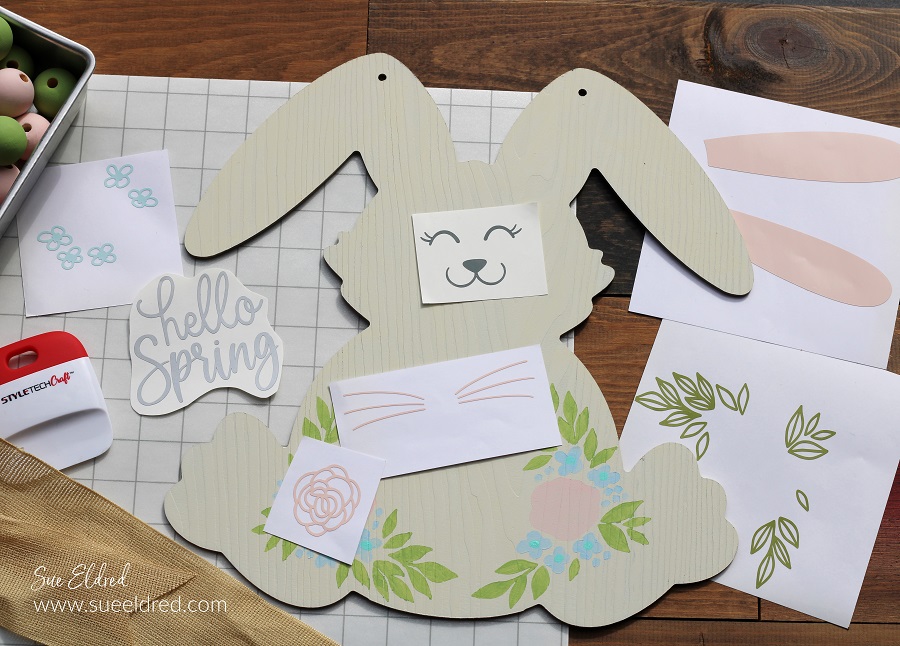 How to make a Spring Bunny Door Hanger with a Dollar Tree Bunny, Acrylic Paint, and StyleTechCraft Glossy Craft Vinyl.