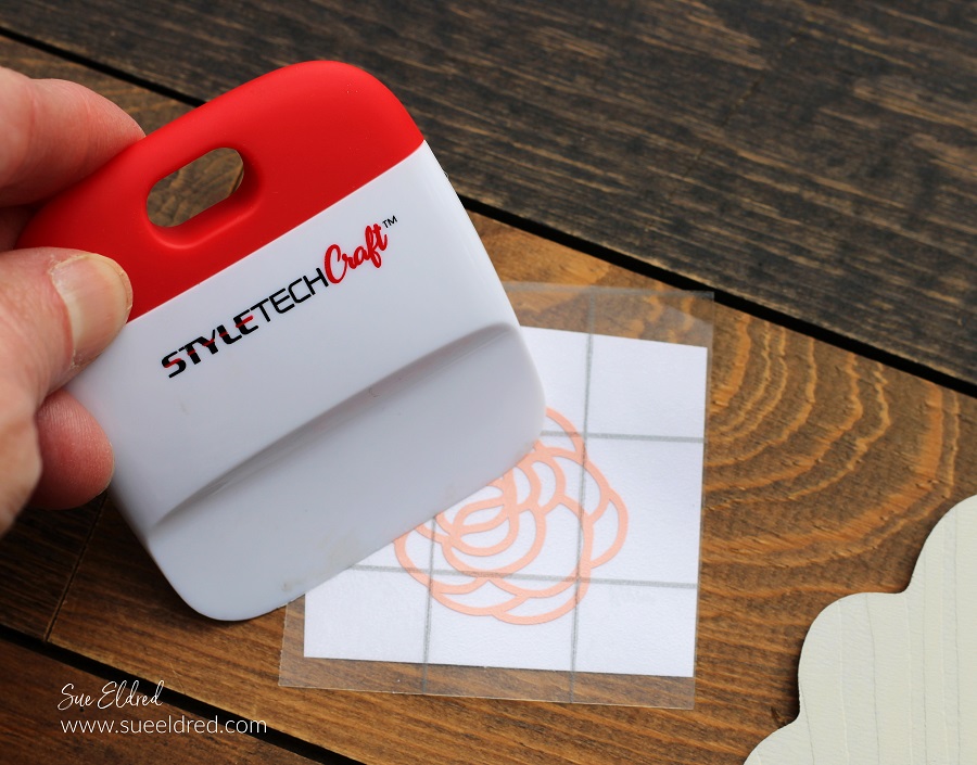 How to make a Spring Bunny Door Hanger with a Dollar Tree Bunny, Acrylic Paint, and StyleTechCraft Glossy Craft Vinyl.