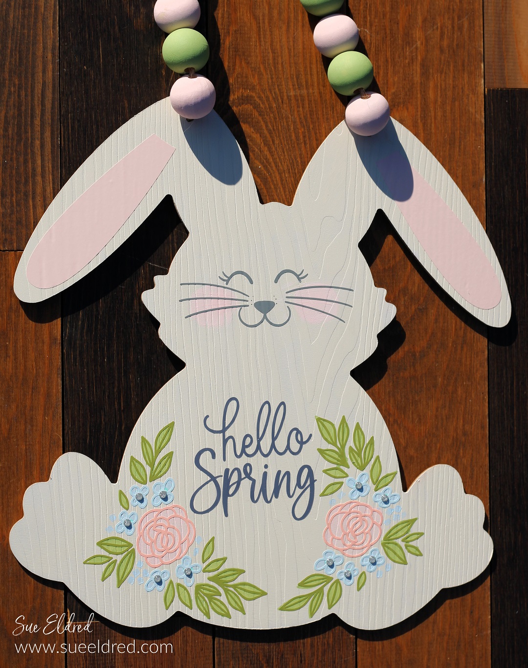 How to make a Spring Bunny Door Hanger with a Dollar Tree Bunny, Acrylic Paint, and StyleTechCraft Glossy Craft Vinyl.